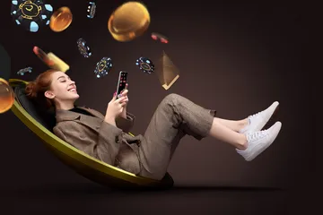 ILOTBED Mobile Casino — Play anytime, anywhere A player using their smartphone during a festive local event, representing ILOTBED’s fully mobile-friendly casino.